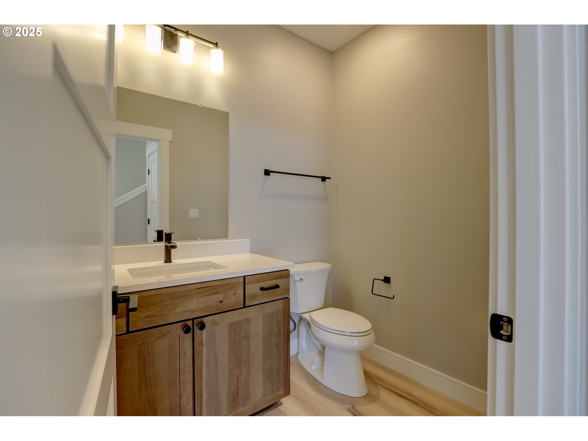 211 Heisler Street Dufur, OR 97021 - Photo 15 of 26 a bathroom with a sink mirror toilet and vanity
