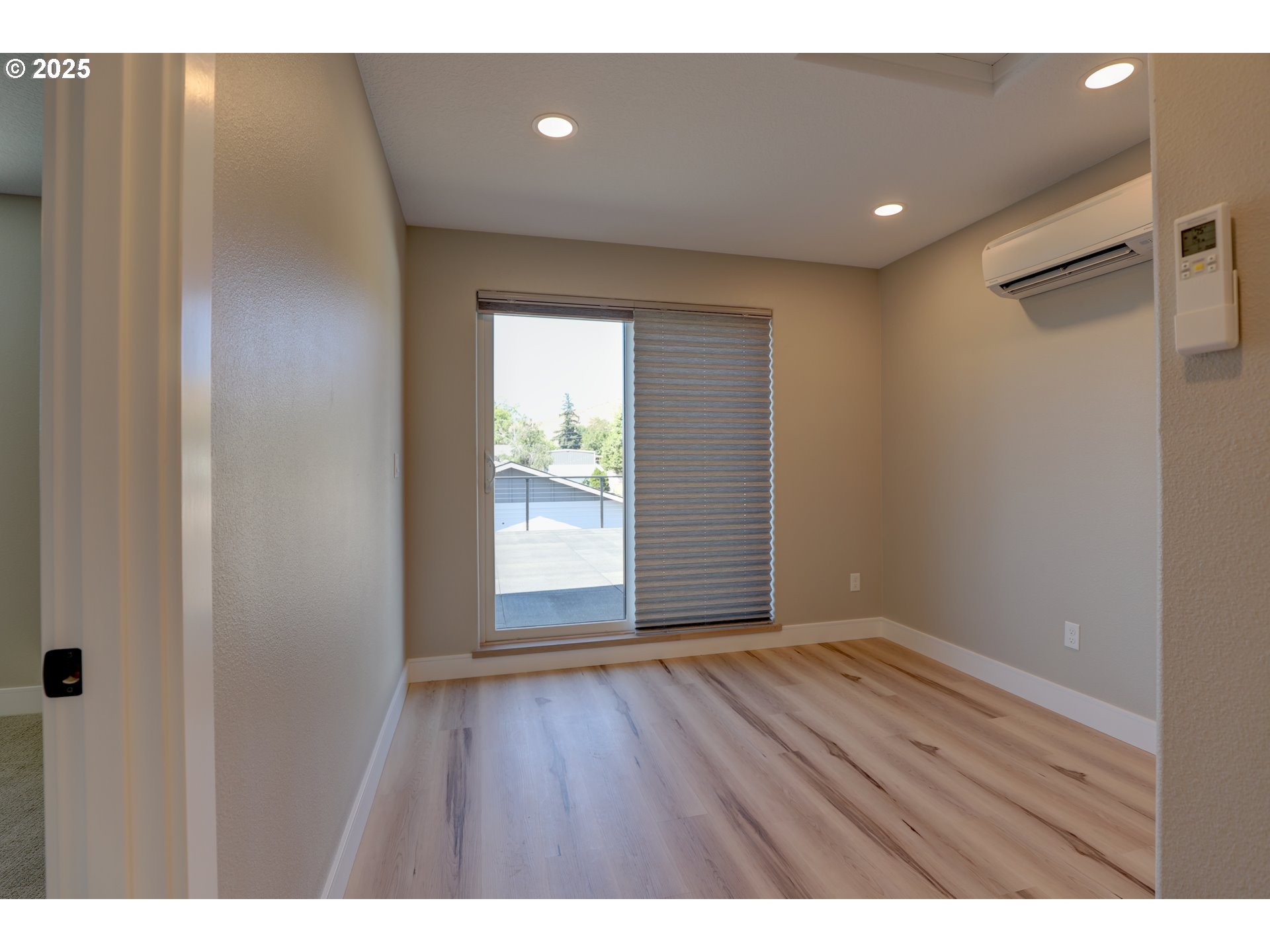 211 Heisler Street Dufur, OR 97021 - Photo 20 of 26 a view of an empty room with wooden floor and a window