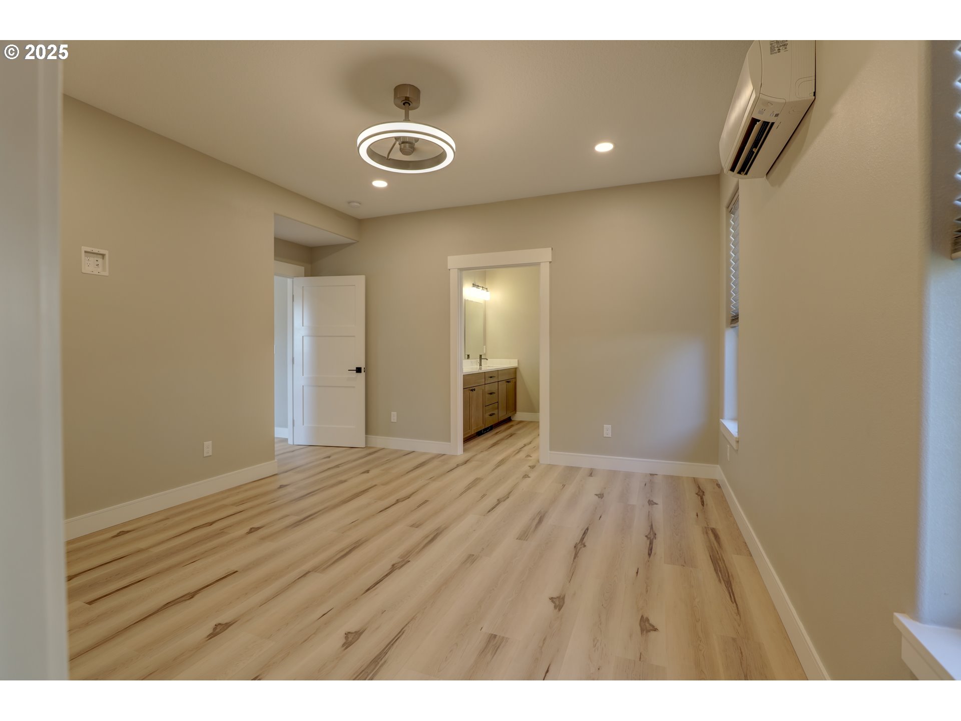211 Heisler Street Dufur, OR 97021 - Photo 5 of 26 a view of an empty room with wooden floor and a window