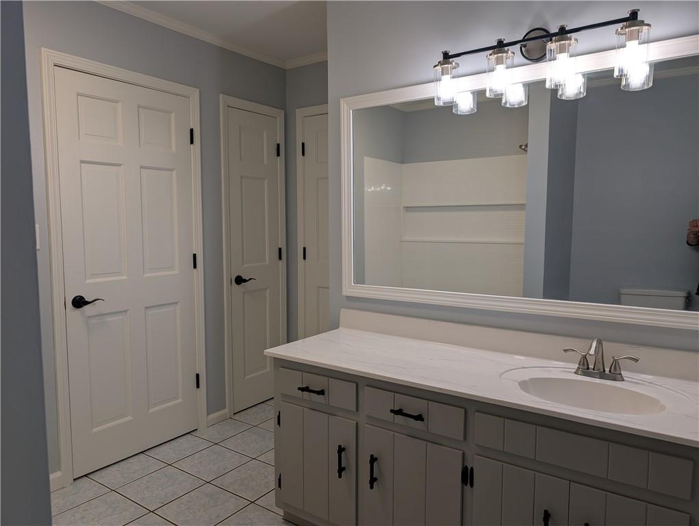 402 Pheasant Run Rome, GA 30161 - Photo 54 of 74 a bathroom with a sink and a mirror