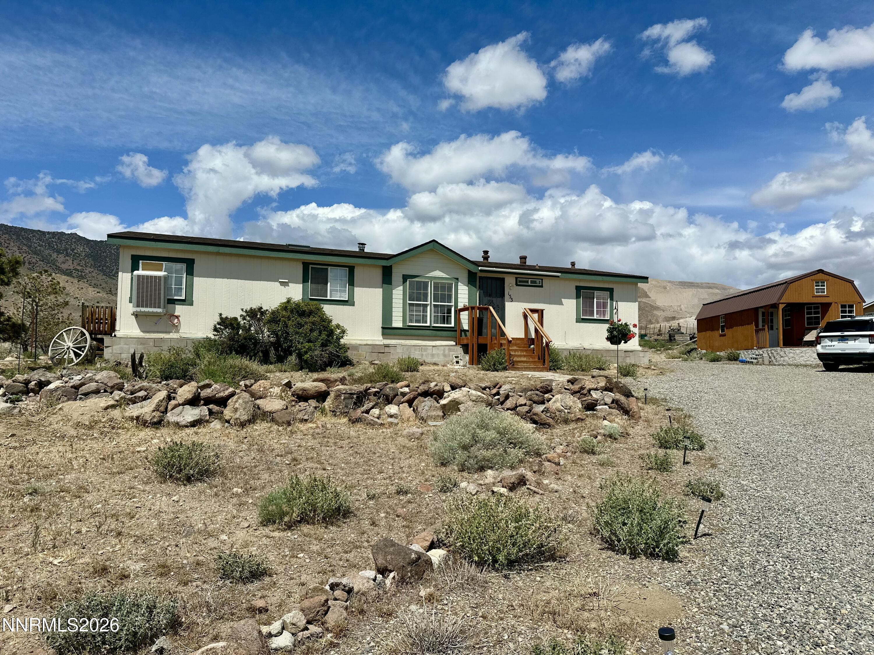 153 Territory Road Dayton, NV 89403 - Photo 1 of 23 a view of a house with a patio