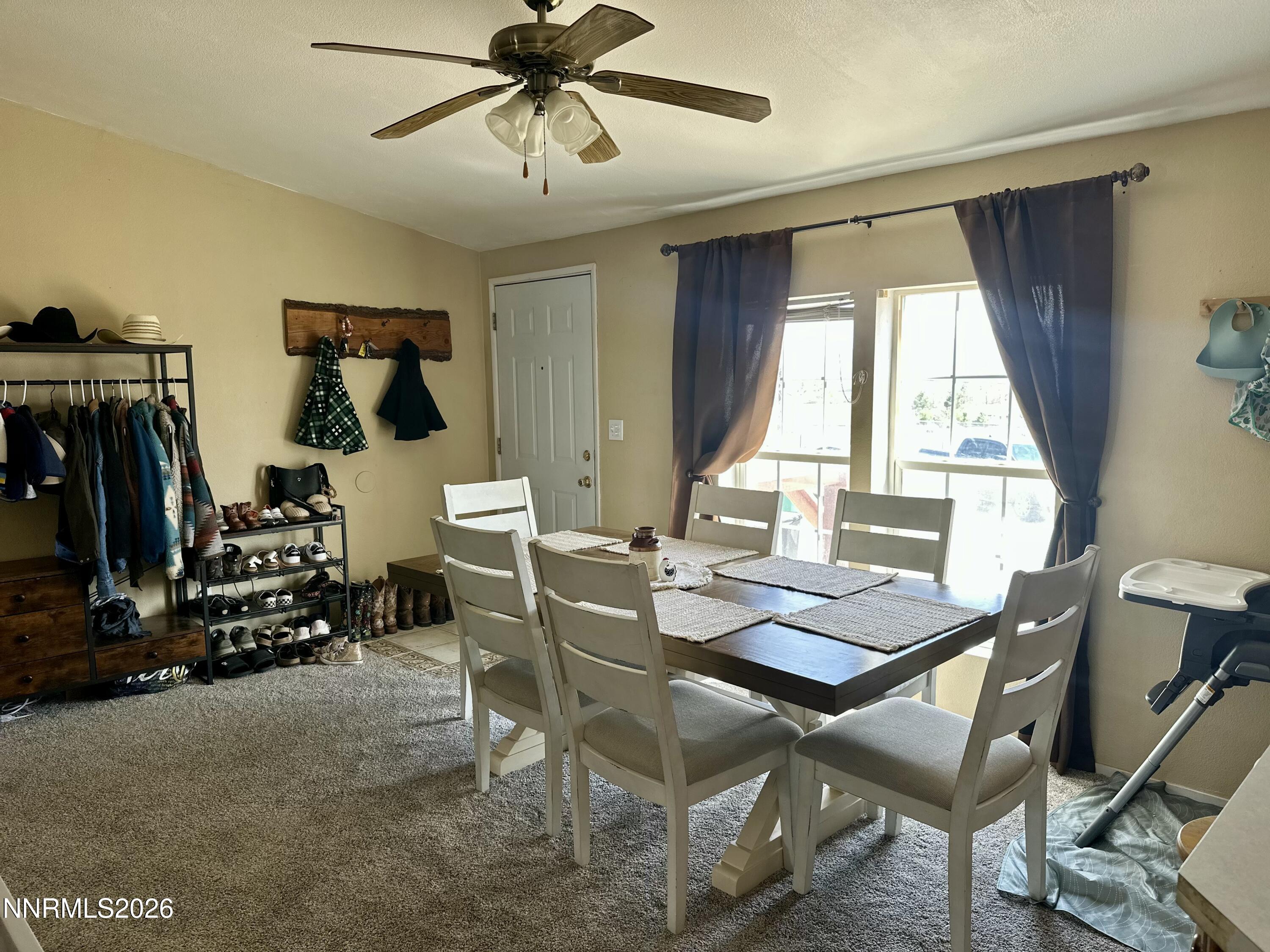 153 Territory Road Dayton, NV 89403 - Photo 14 of 23 a view of a workspace with furniture and a window
