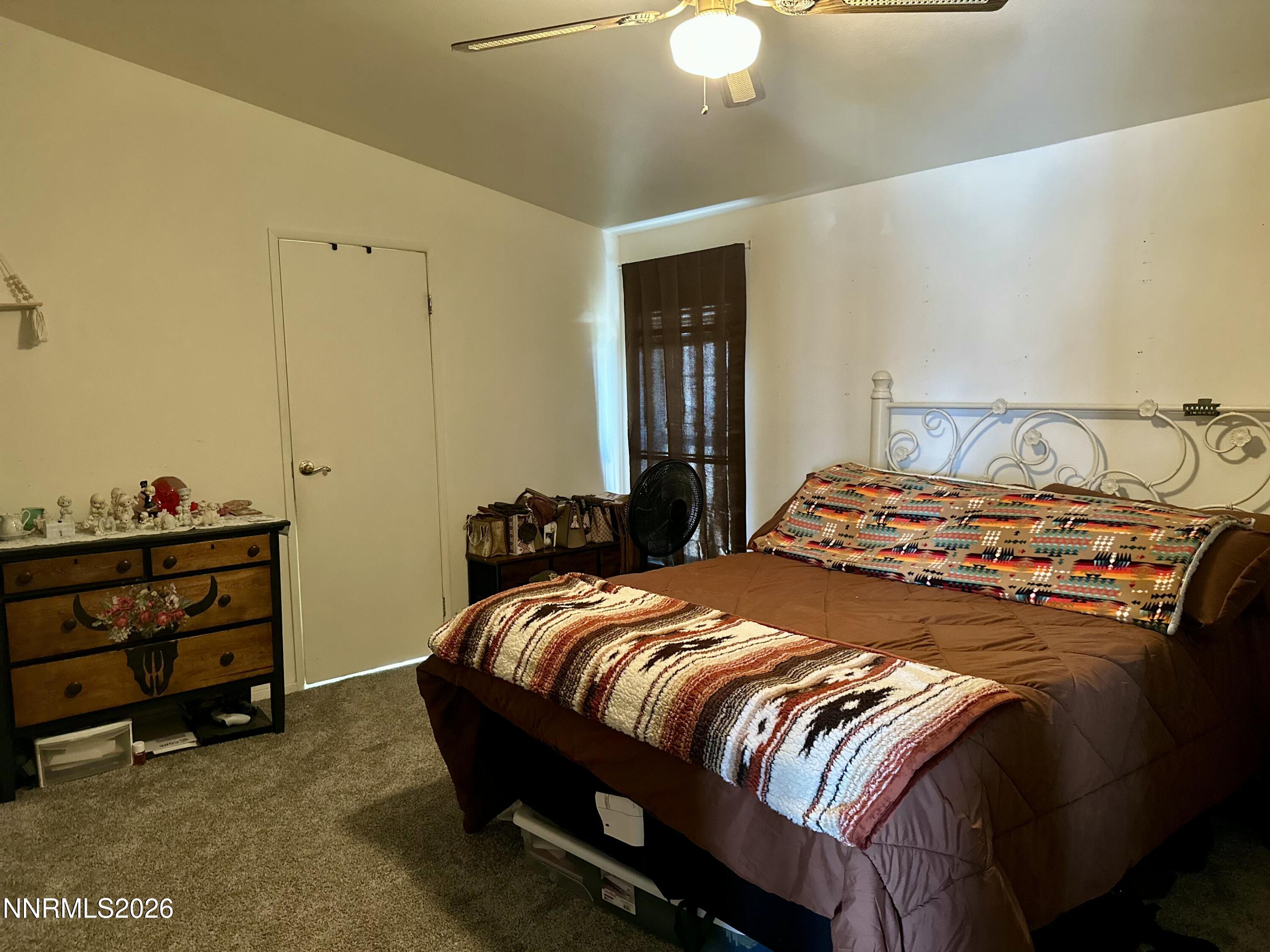 153 Territory Road Dayton, NV 89403 - Photo 15 of 23 a bedroom with a bed and a closet
