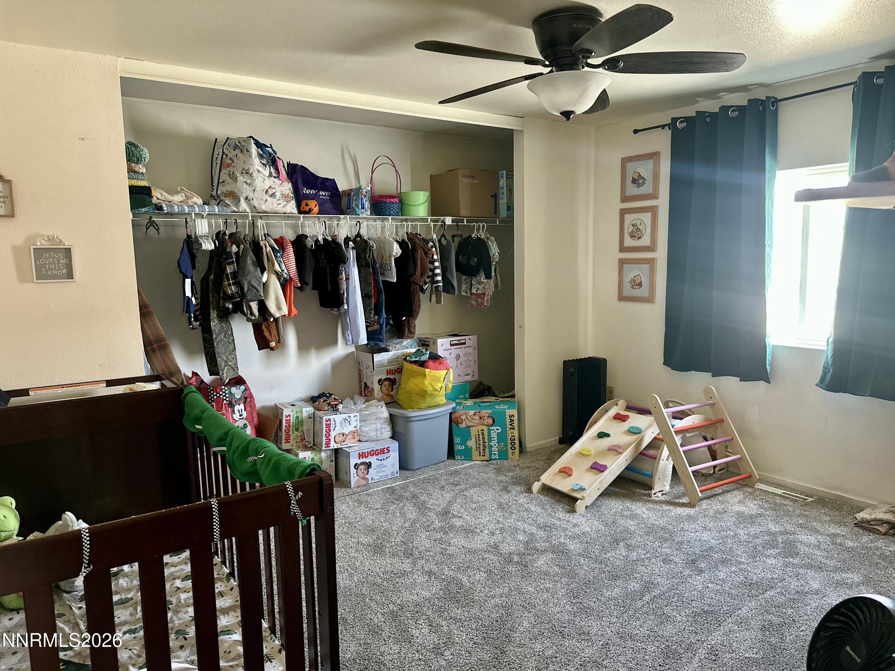 153 Territory Road Dayton, NV 89403 - Photo 18 of 23 a storage room with lots of stuff and hardwood floor