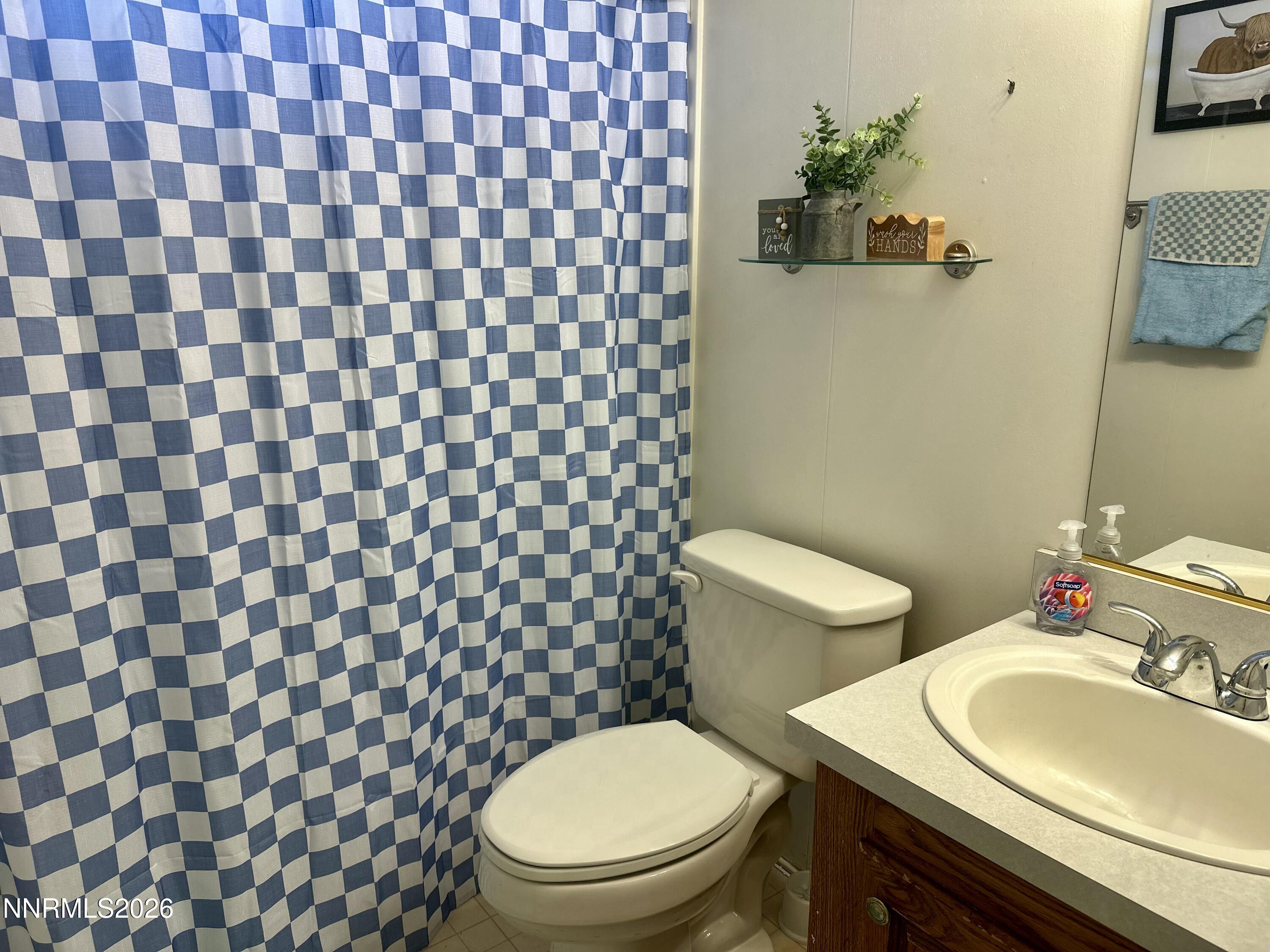 153 Territory Road Dayton, NV 89403 - Photo 21 of 23 a bathroom with a sink and a toilet