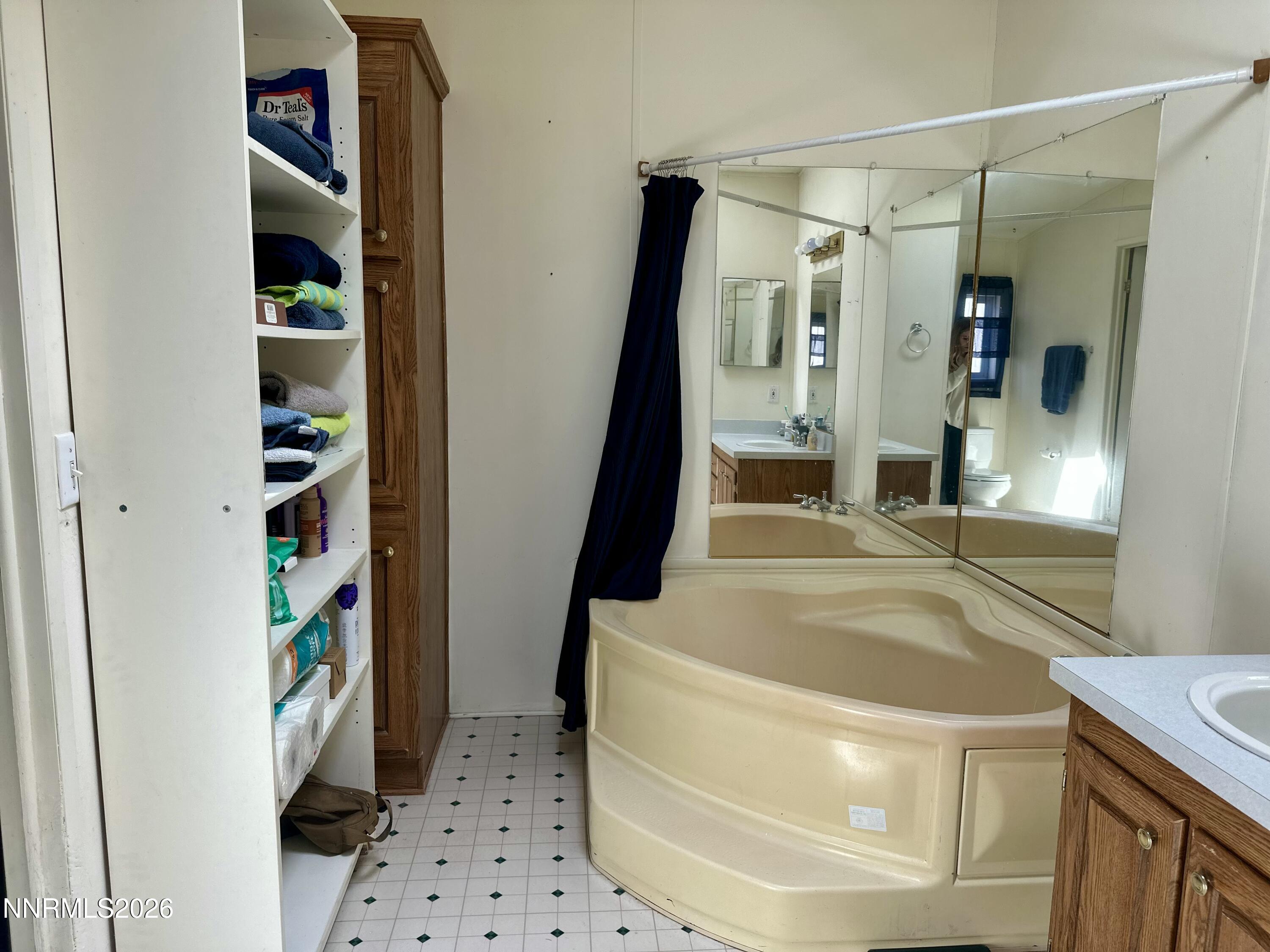 153 Territory Road Dayton, NV 89403 - Photo 22 of 23 a bathroom with a tub and a shower