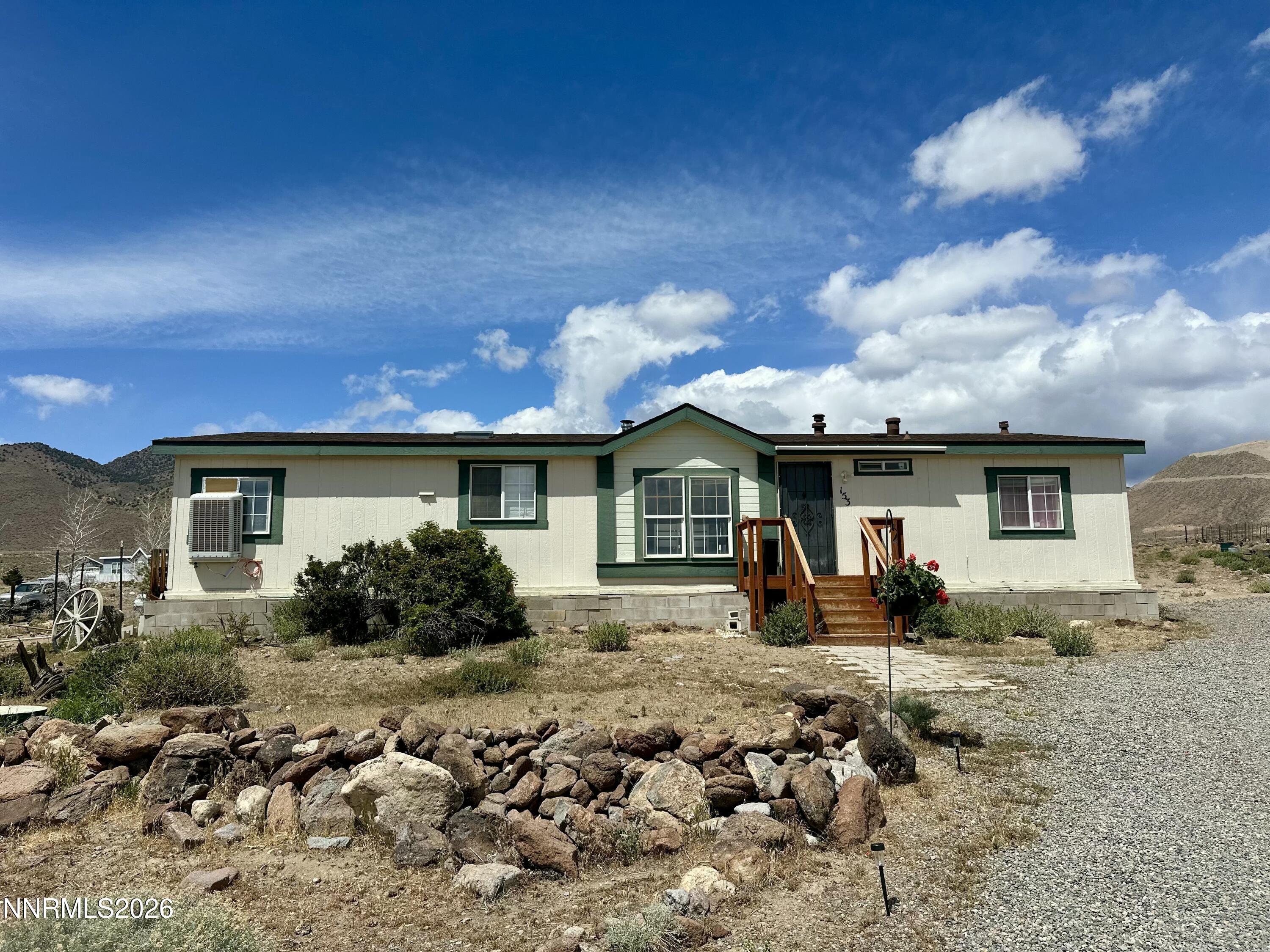 153 Territory Road Dayton, NV 89403 - Photo 4 of 23 a front view of a house with a yard