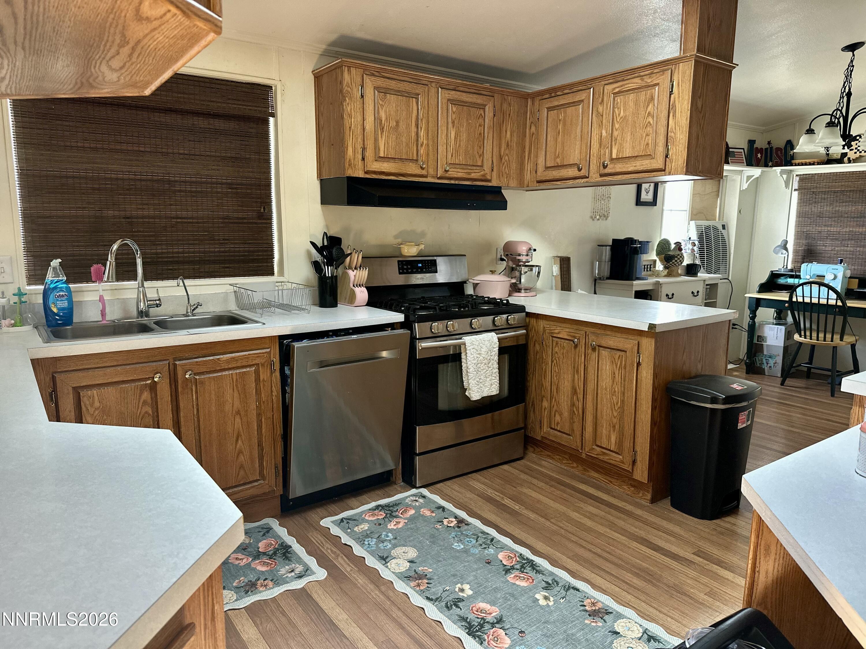 153 Territory Road Dayton, NV 89403 - Photo 8 of 23 a kitchen with stainless steel appliances granite countertop a sink stove and refrigerator