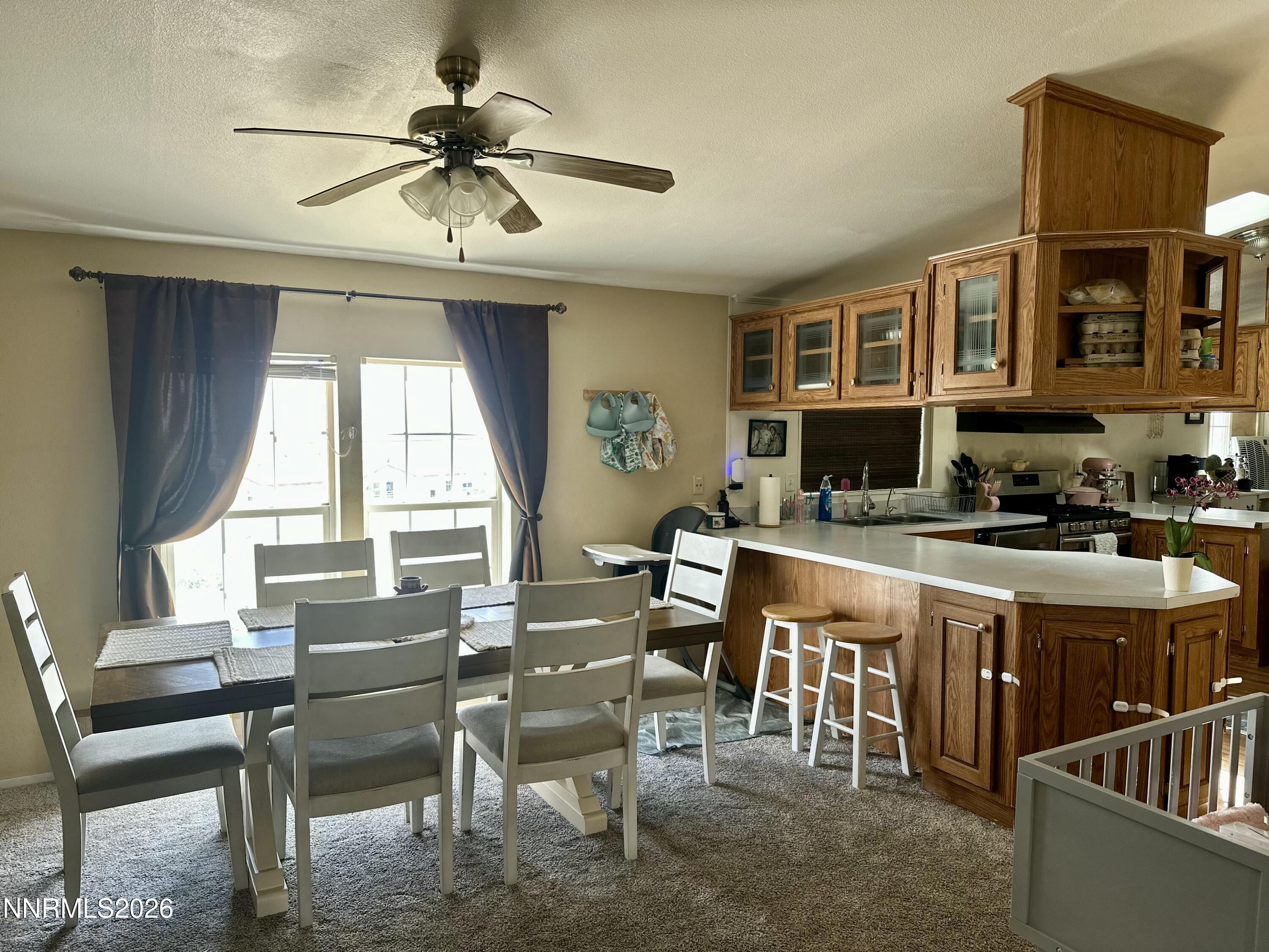 153 Territory Road Dayton, NV 89403 - Photo 9 of 23 a large kitchen with a table and chairs