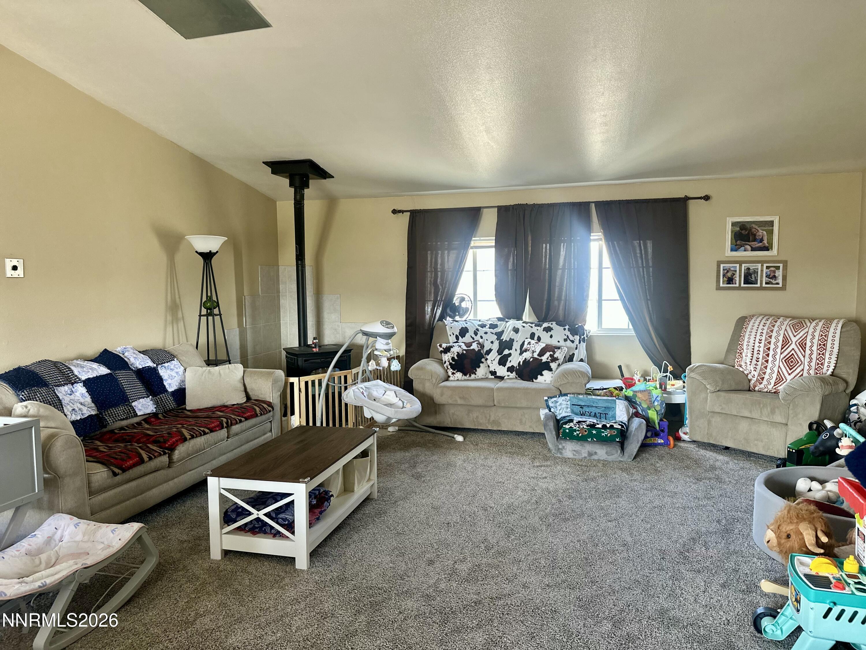153 Territory Road Dayton, NV 89403 - Photo 10 of 23 a living room with furniture and a table