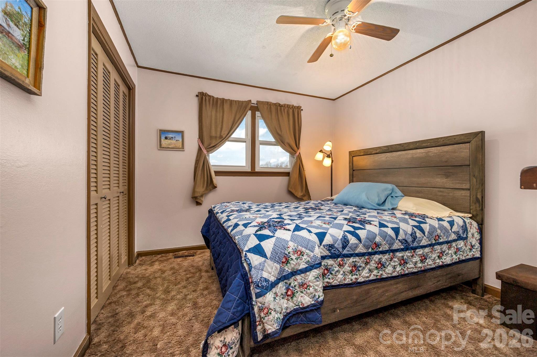 414 Sandy Run Church Road Mooresboro, NC 28114 - Photo 22 of 38 a bedroom with a bed mirror and window