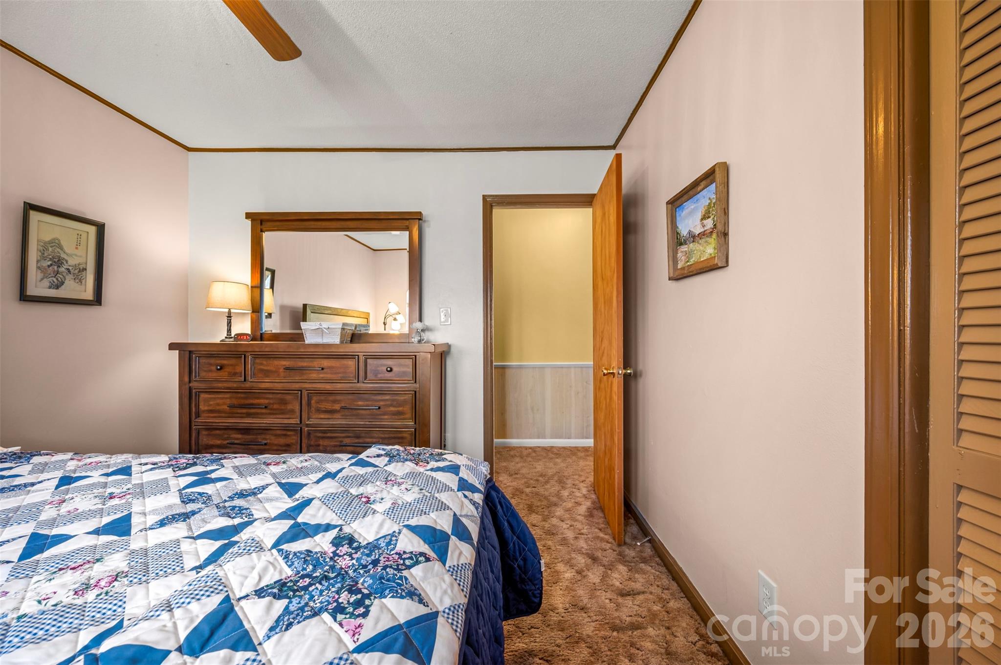 414 Sandy Run Church Road Mooresboro, NC 28114 - Photo 23 of 38 a bedroom with a bed and a dresser in it