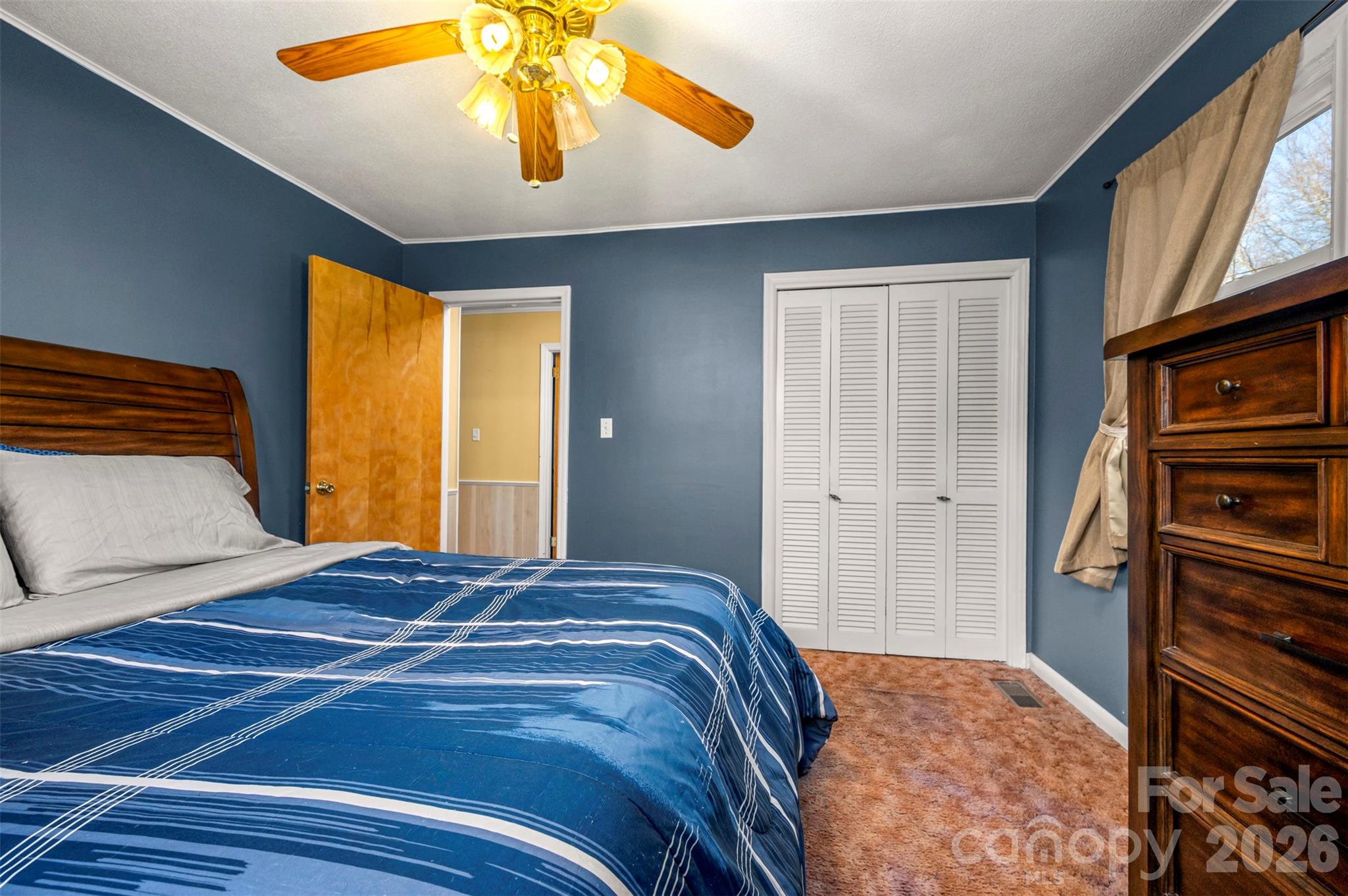 414 Sandy Run Church Road Mooresboro, NC 28114 - Photo 26 of 38 a bedroom with a bed and a chandelier