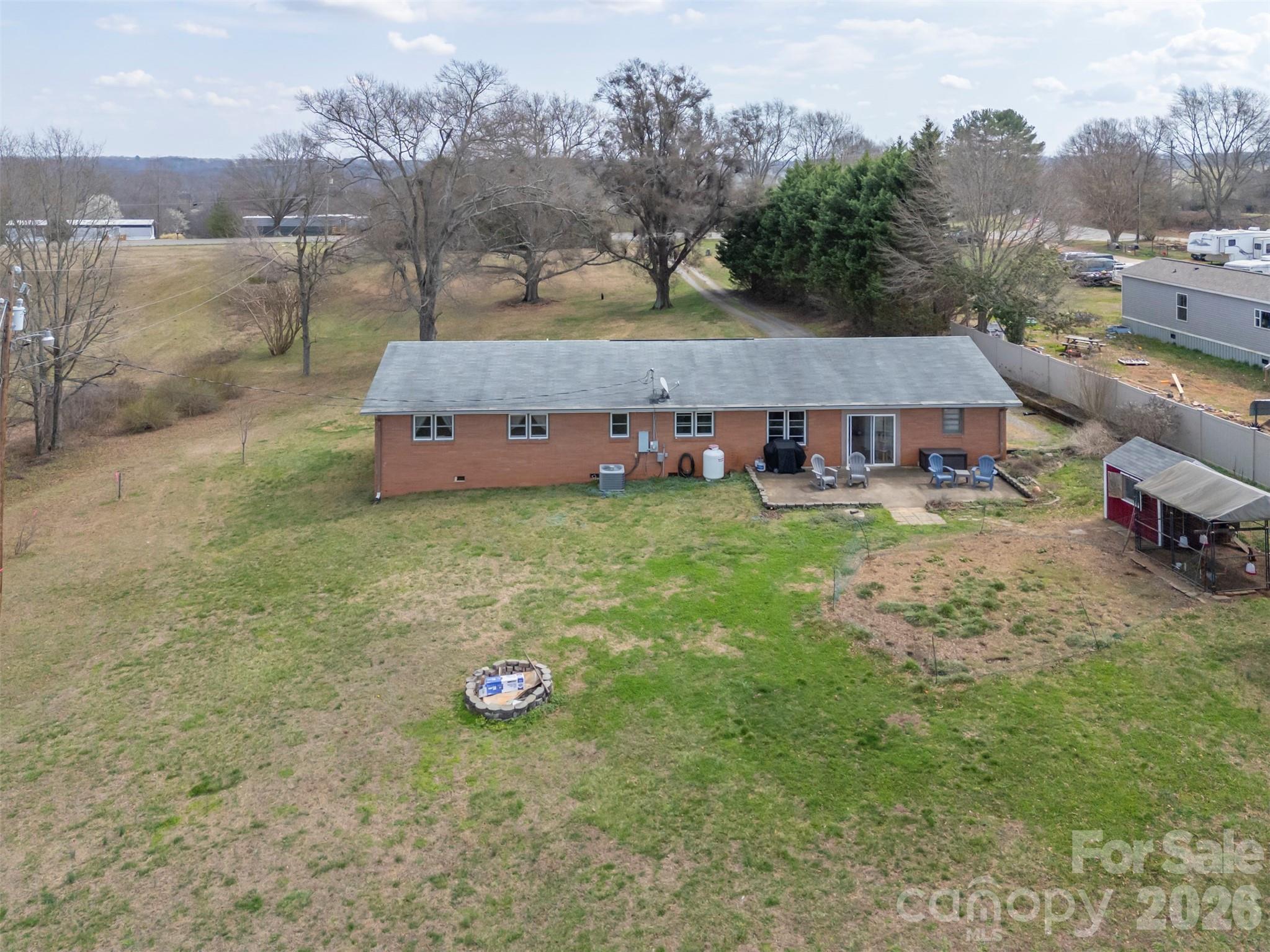 414 Sandy Run Church Road Mooresboro, NC 28114 - Photo 31 of 38 an aerial view of a house with garden space and sitting area