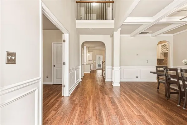 a view of a dining room with furniture and wooden floor