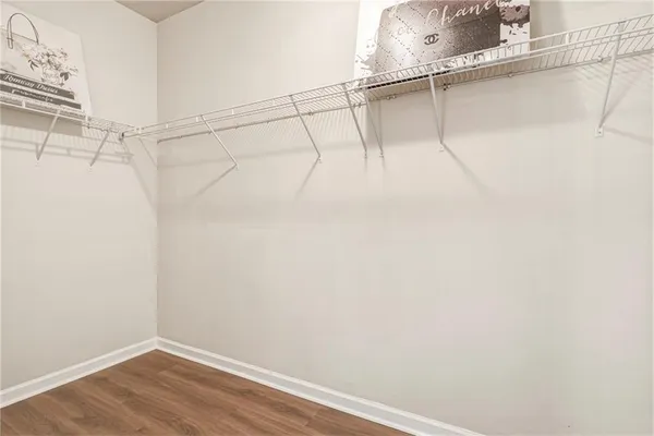 a bedroom with a bed and a ceiling fan