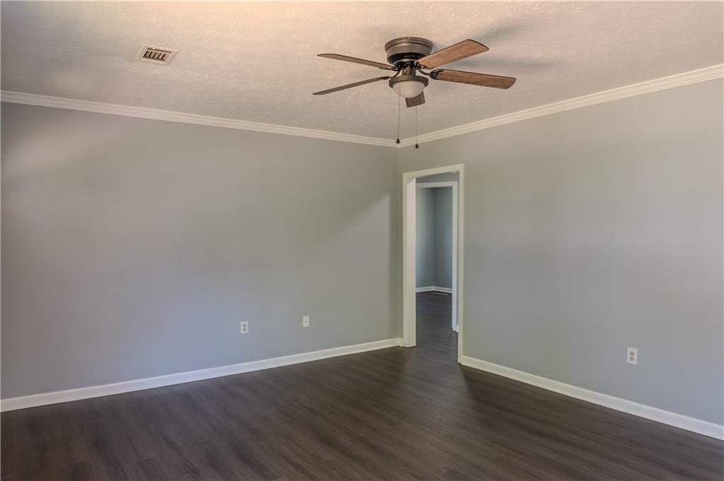 53 Washington Drive Forsyth, GA 31029 - Photo 4 of 19 a view of an empty room with wooden floor