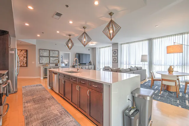 a large kitchen with stainless steel appliances granite countertop lots of counter top space