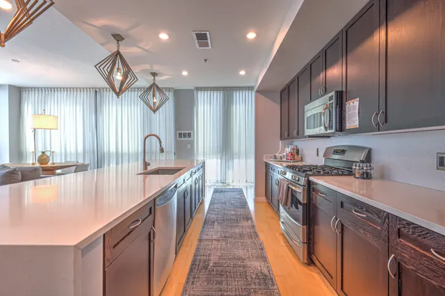 a view of living room filled with furniture and window