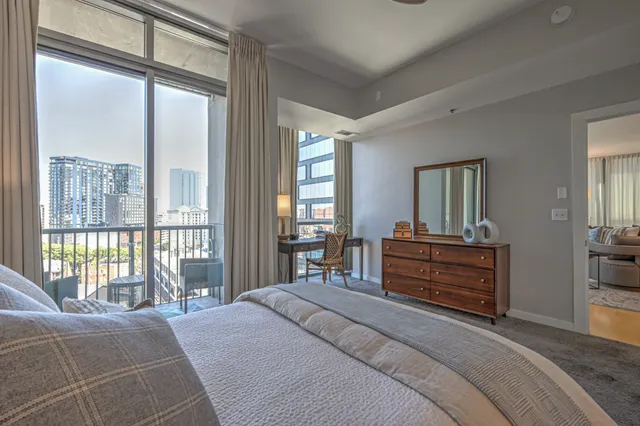 a balcony with chairs and wooden floor