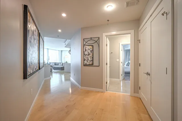 a living room with furniture a table and a large window