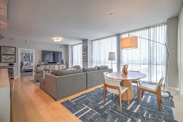 a living room with furniture and a window