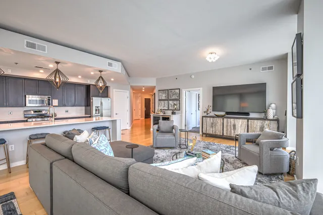 a large living room with a large window