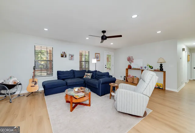 a dining table with chairs and window
