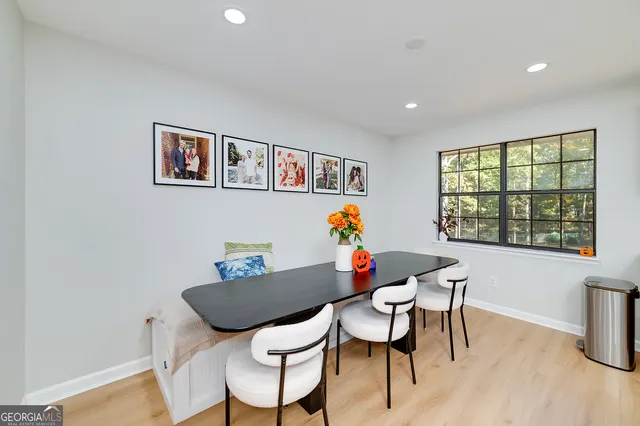 a open kitchen with stainless steel appliances granite countertop a sink dishwasher and a stove with wooden floor