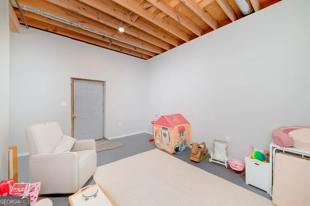 a room with furniture and a flat screen tv