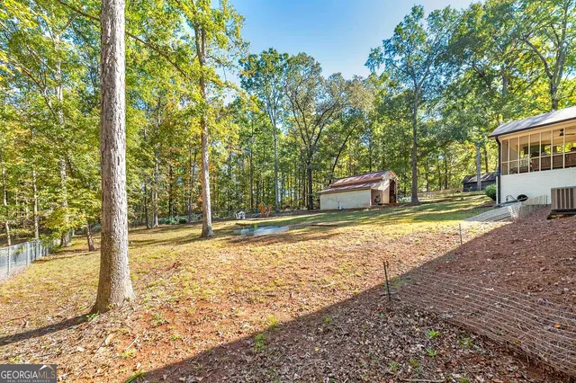 a living room with furniture and a book shelf