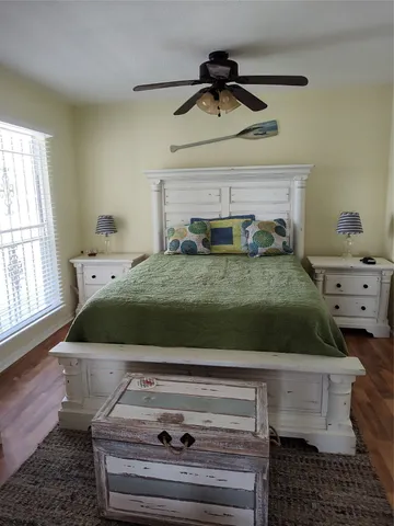 a bed sitting in a bedroom and dresser