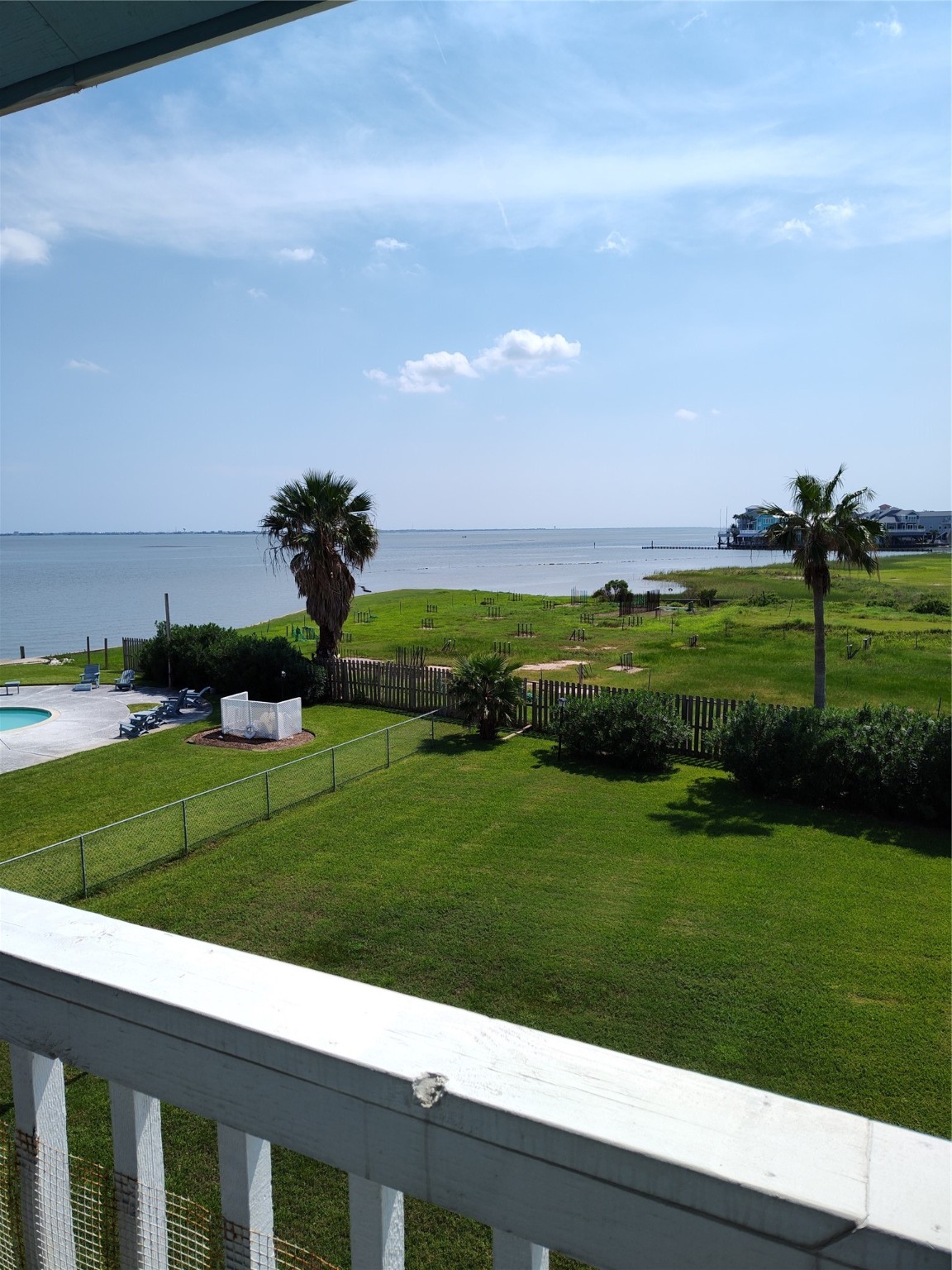 500 Tiki Drive, Unit 213 Tiki Island, TX 77554 - Photo 24 of 25 a view of a grassy area