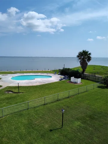 a view of a golf course with chairs