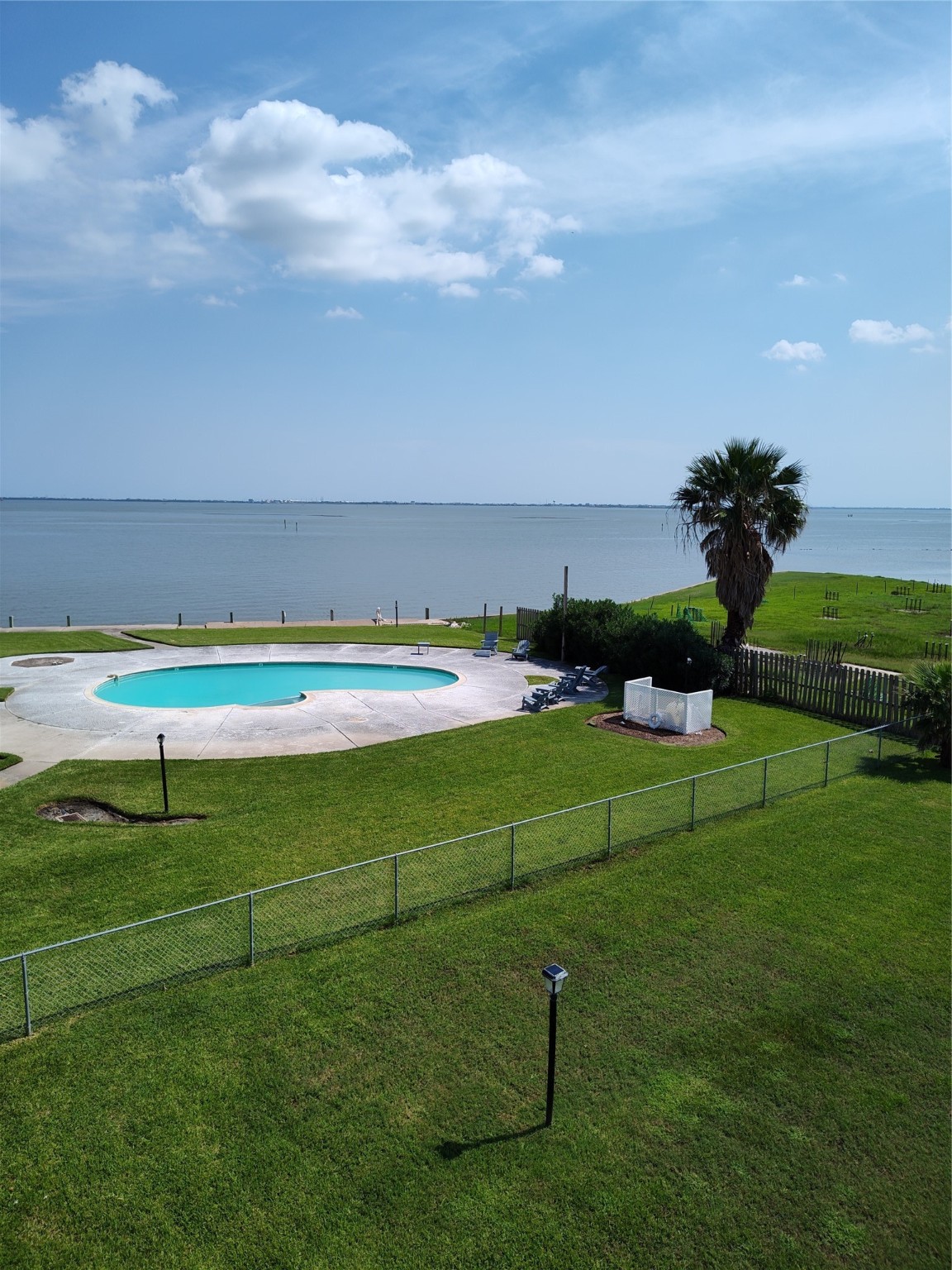 500 Tiki Drive, Unit 213 Tiki Island, TX 77554 - Photo 25 of 25 a view of a golf course with chairs