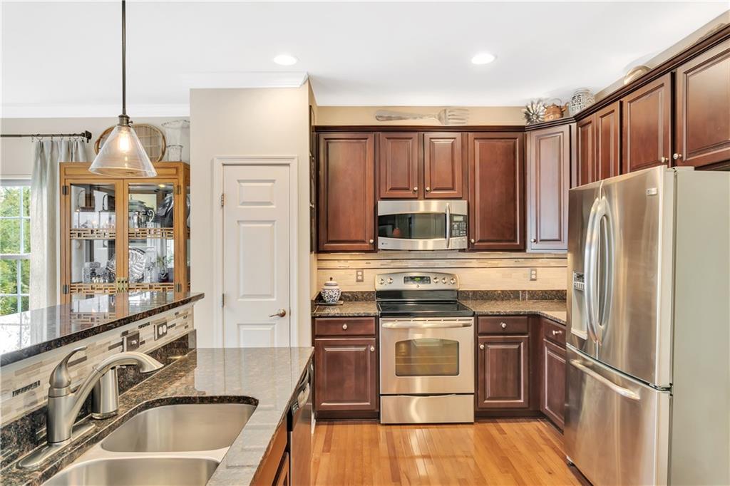 284 Maple Ridge Drive Canonsburg, PA 15317 - Photo 13 of 25 Stainless appliances, granite counters, 42" Cherry (Espresso tone) Cabinets & pantry complete your kitchen!