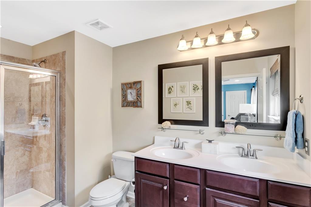 284 Maple Ridge Drive Canonsburg, PA 15317 - Photo 17 of 25 Owner's full bath with ceramic tile shower & flooring, dual sinks, mirrors & plenty of counter space!