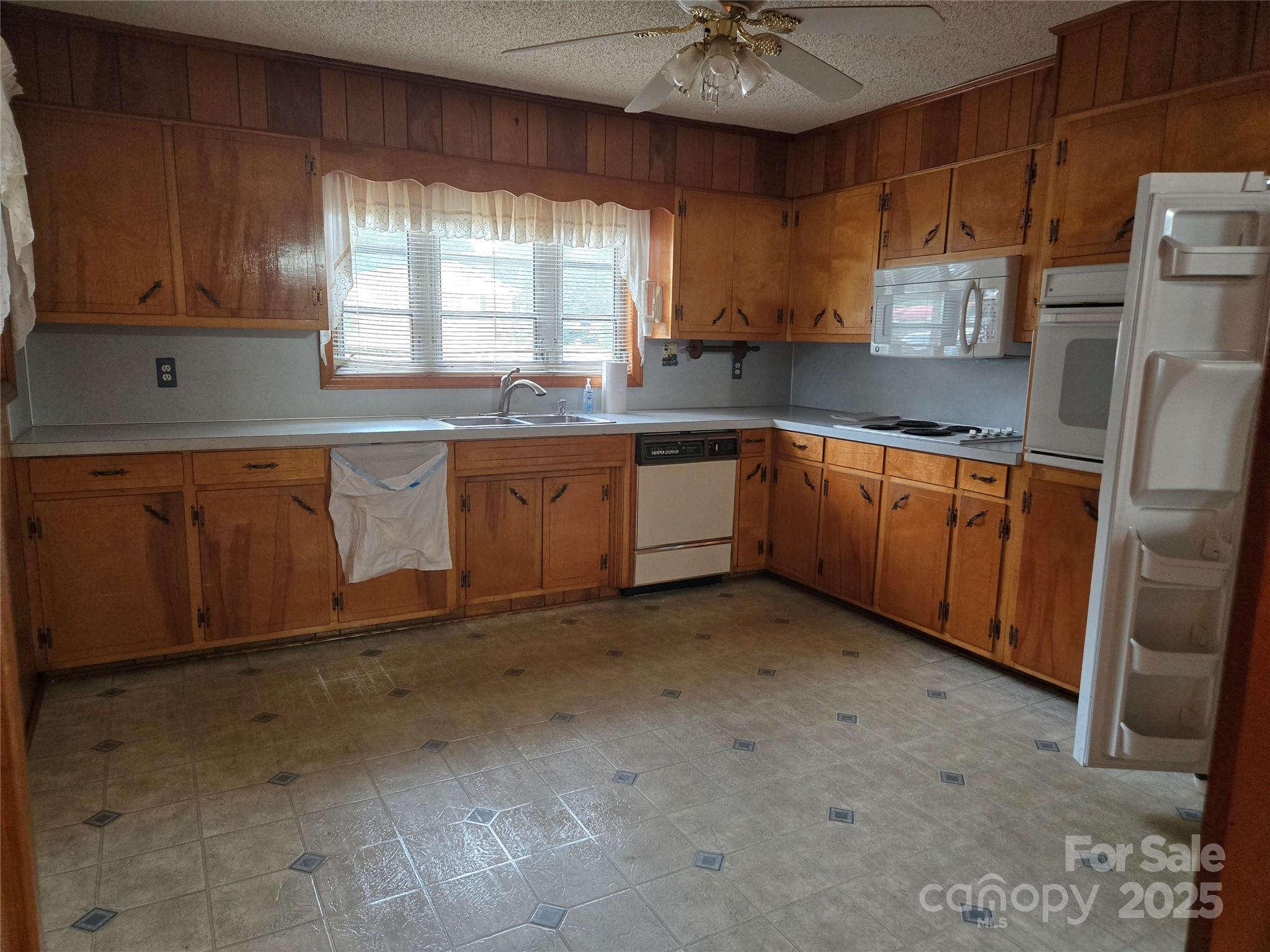 541 Old NC 277 Road Bessemer City, NC 28016 - Photo 13 of 26 a kitchen with granite countertop a sink cabinets stainless steel appliances and a window
