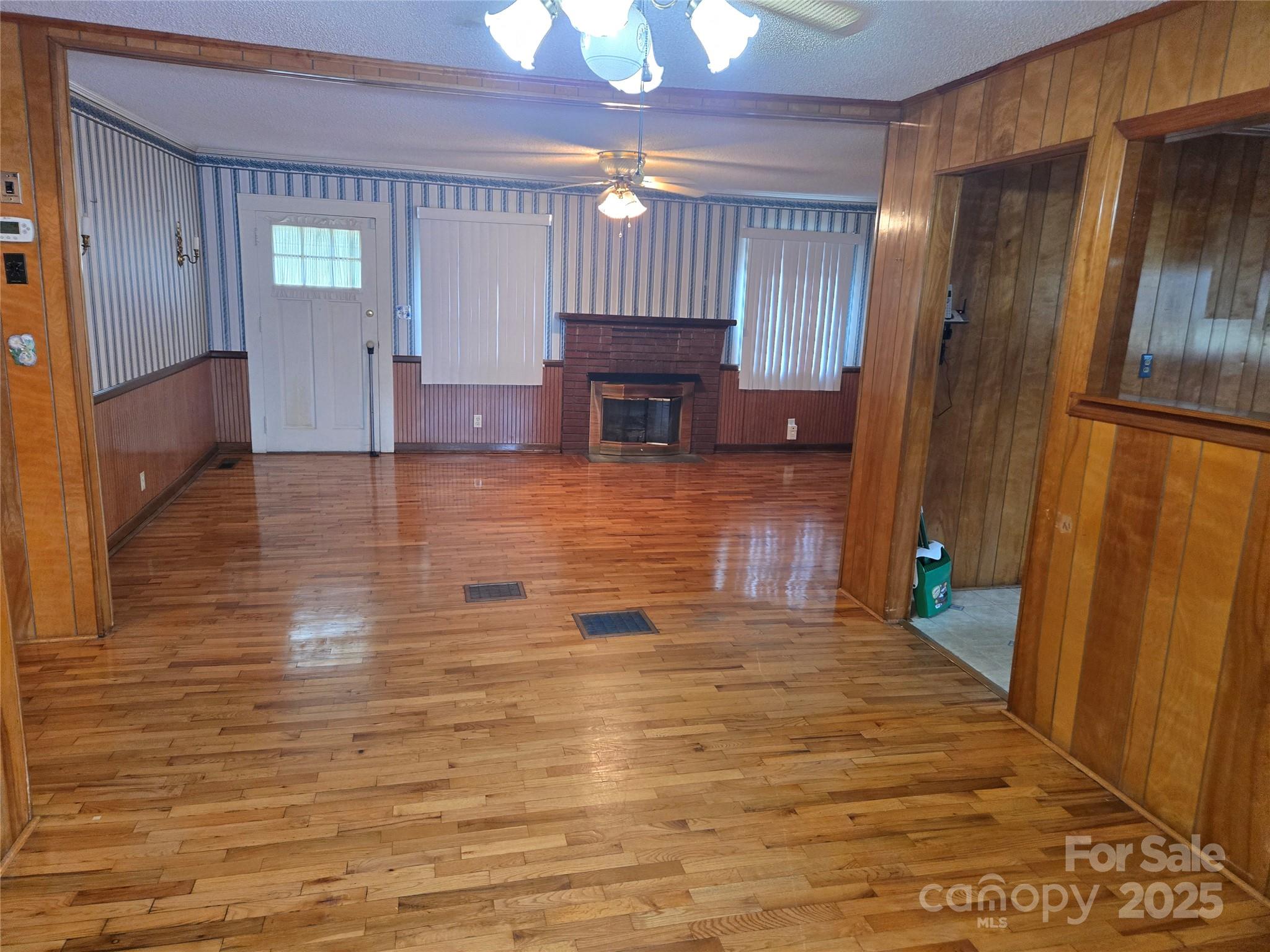 541 Old NC 277 Road Bessemer City, NC 28016 - Photo 19 of 26 a view of a livingroom with wooden floor and a refrigerator