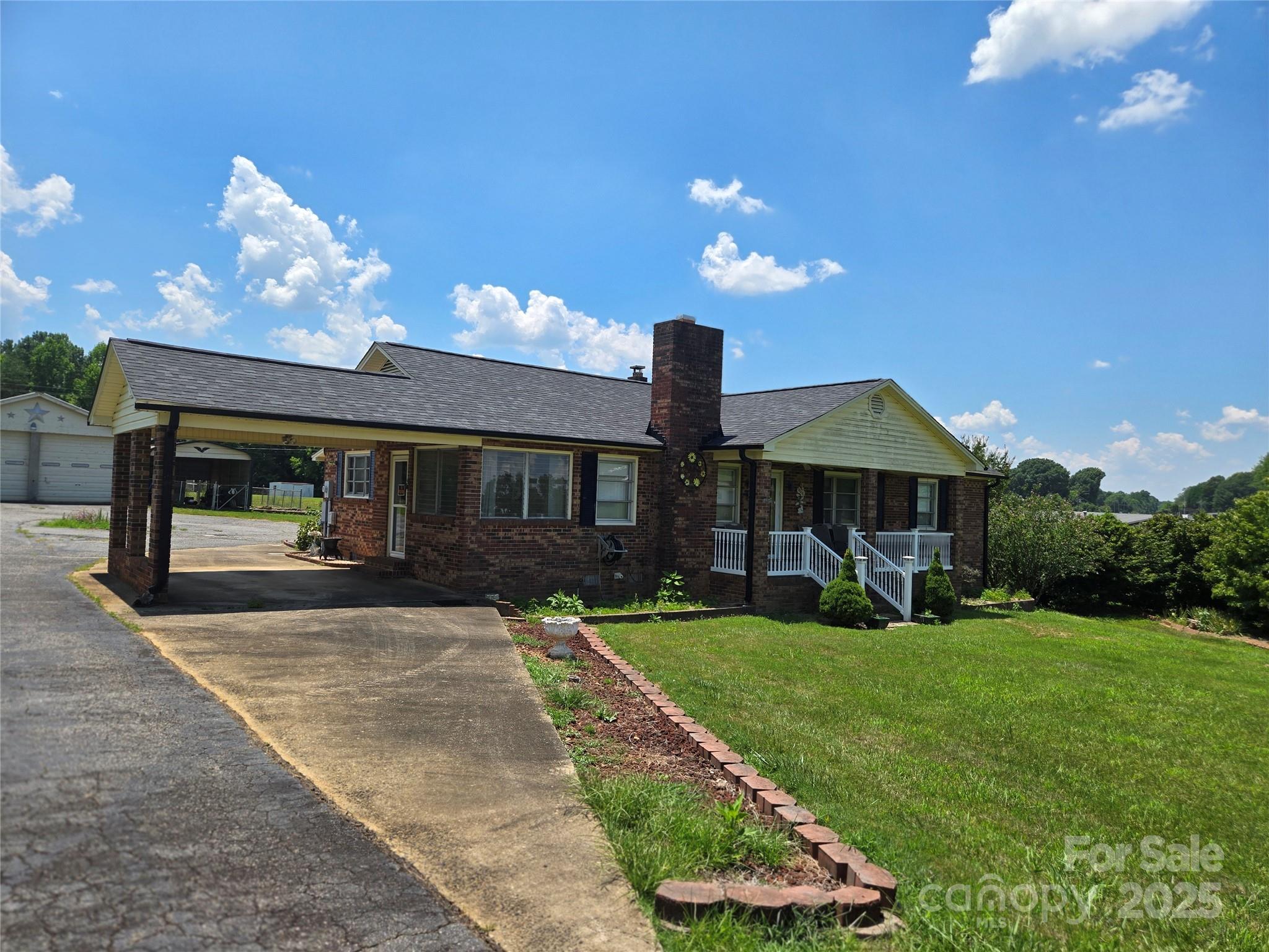 541 Old NC 277 Road Bessemer City, NC 28016 - Photo 5 of 26 a view of a house with backyard and sitting area