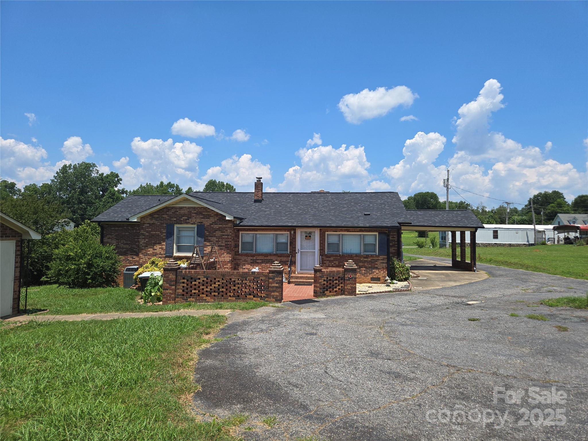 541 Old NC 277 Road Bessemer City, NC 28016 - Photo 8 of 26 a front view of a house with garden