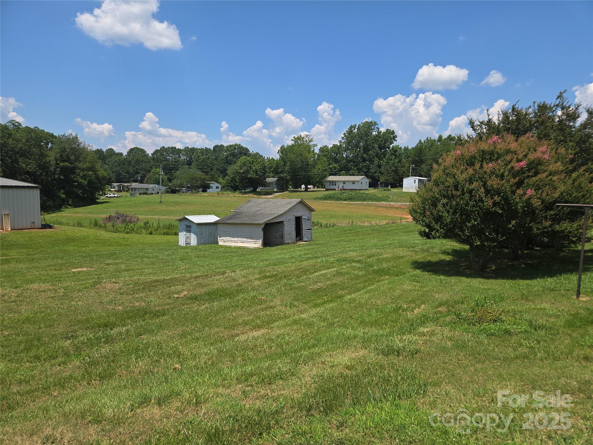 541 Old NC 277 Road Bessemer City, NC 28016 - Photo 10 of 26 a swimming pool with outdoor seating and yard