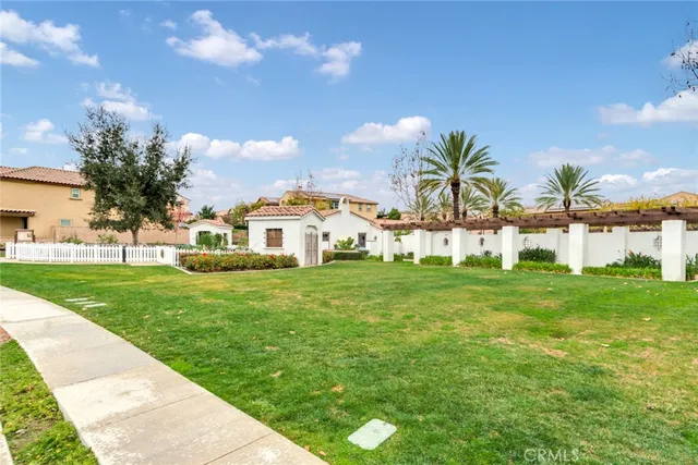 a view of house with garden space and trees