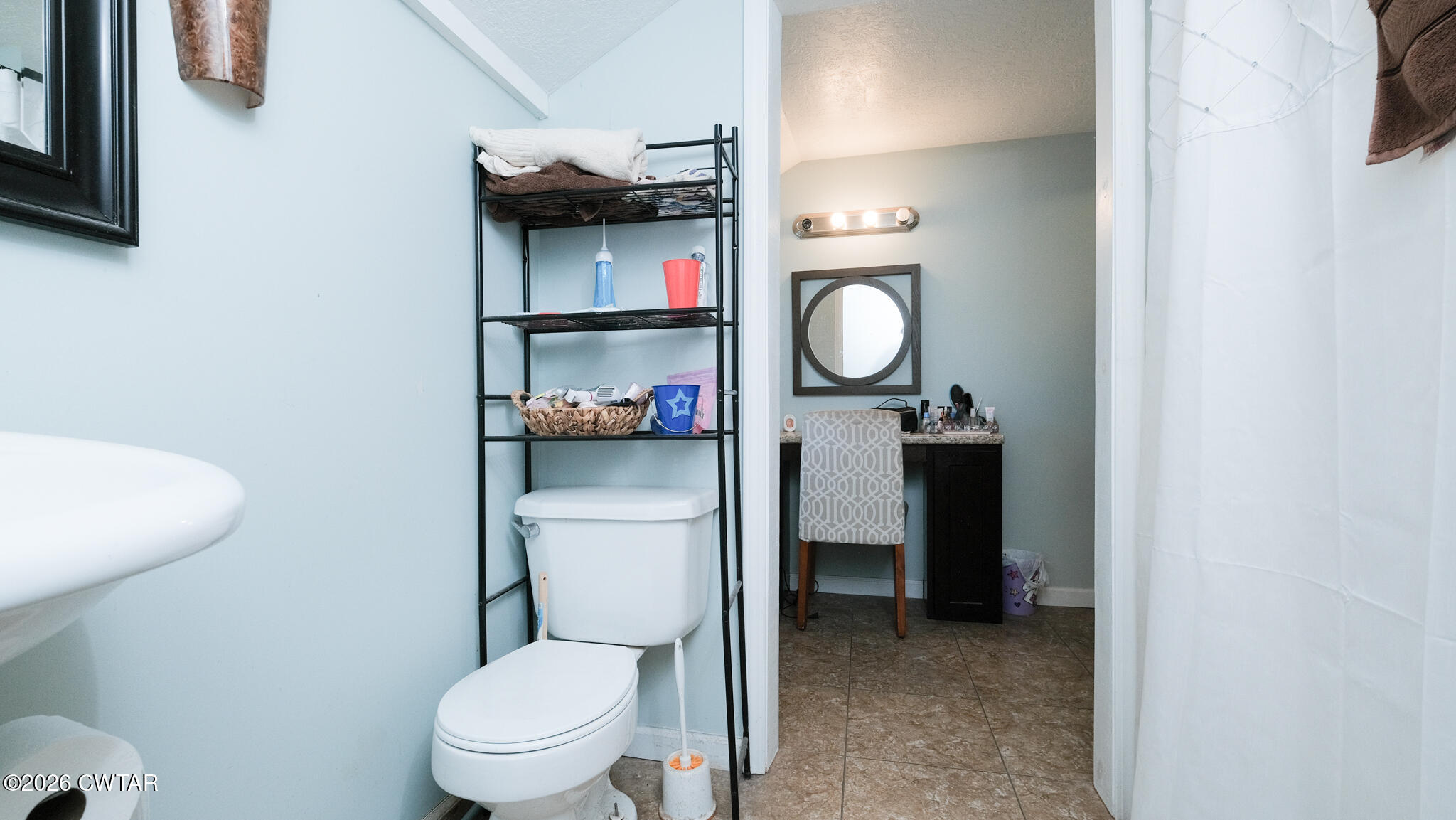 2636 Sidonia Road Sharon, TN 38255 - Photo 11 of 22 a bathroom with a toilet sink vanity and mirror