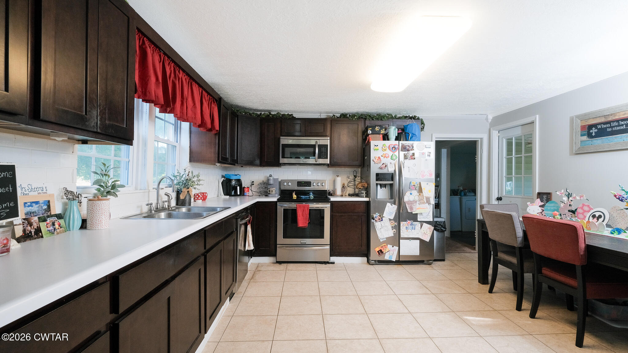 2636 Sidonia Road Sharon, TN 38255 - Photo 7 of 22 a kitchen with refrigerator and cabinets