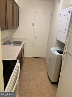 1003 Easton Road, Unit C502 Willow Grove, PA 19090 - Photo 3 of 13 a utility room with a sink a washer and dryer
