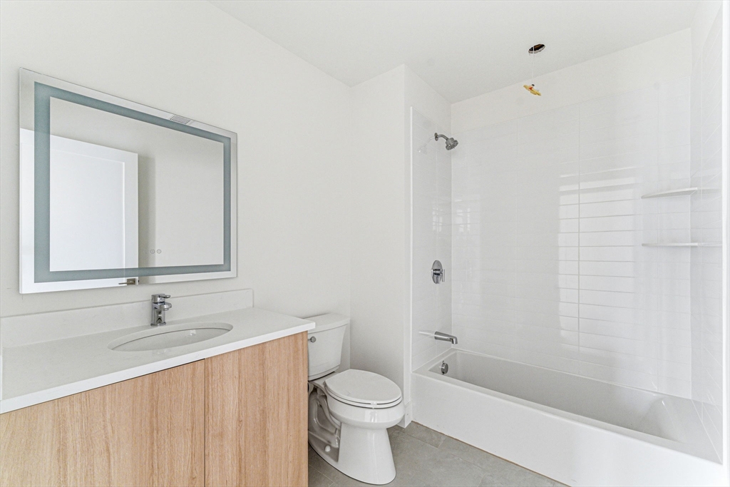 1035 Commonwealth Avenue, Unit 610 Boston, MA 02215 - Photo 7 of 18 a bathroom with a sink toilet and shower