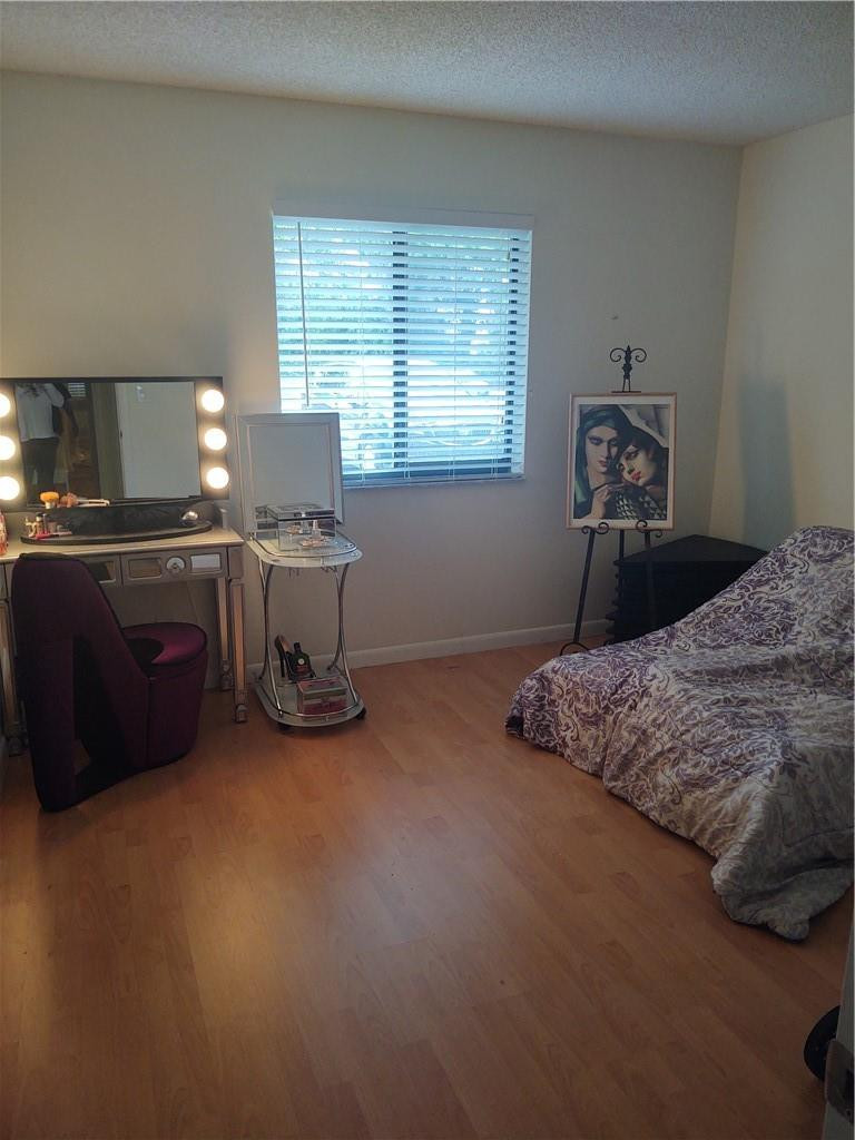 120 Northwest 70th Street, Unit 104 Boca Raton, FL 33487 - Photo 6 of 12 Guest Bedroom