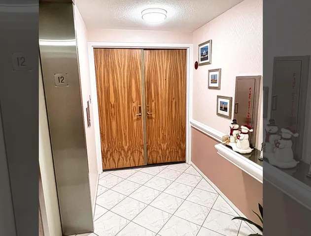 a view of a kitchen with a refrigerator