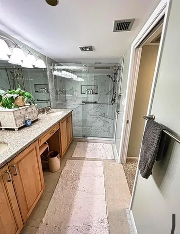 a kitchen with a sink and a refrigerator